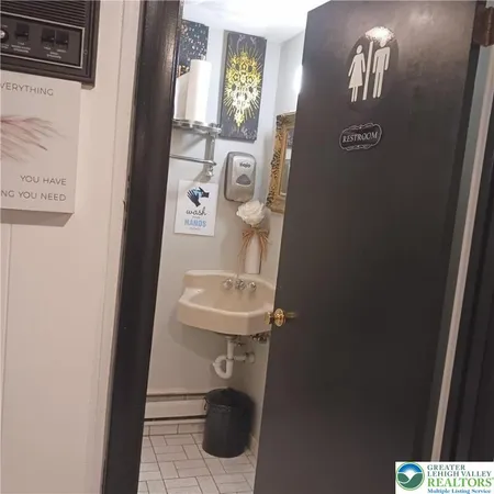 a bathroom with a toilet and a sink
