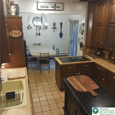 a bathroom with a sink a mirror and a toilet
