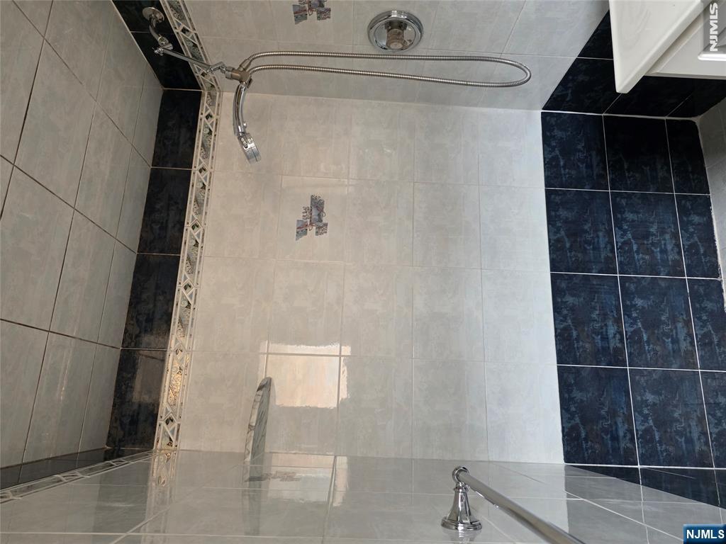 688 Day Avenue, Unit 2 Ridgefield, NJ 07657 - Photo 17 of 18 a bathroom with a shower