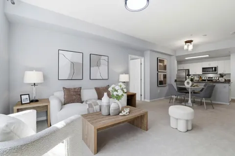 a living room with furniture and a table