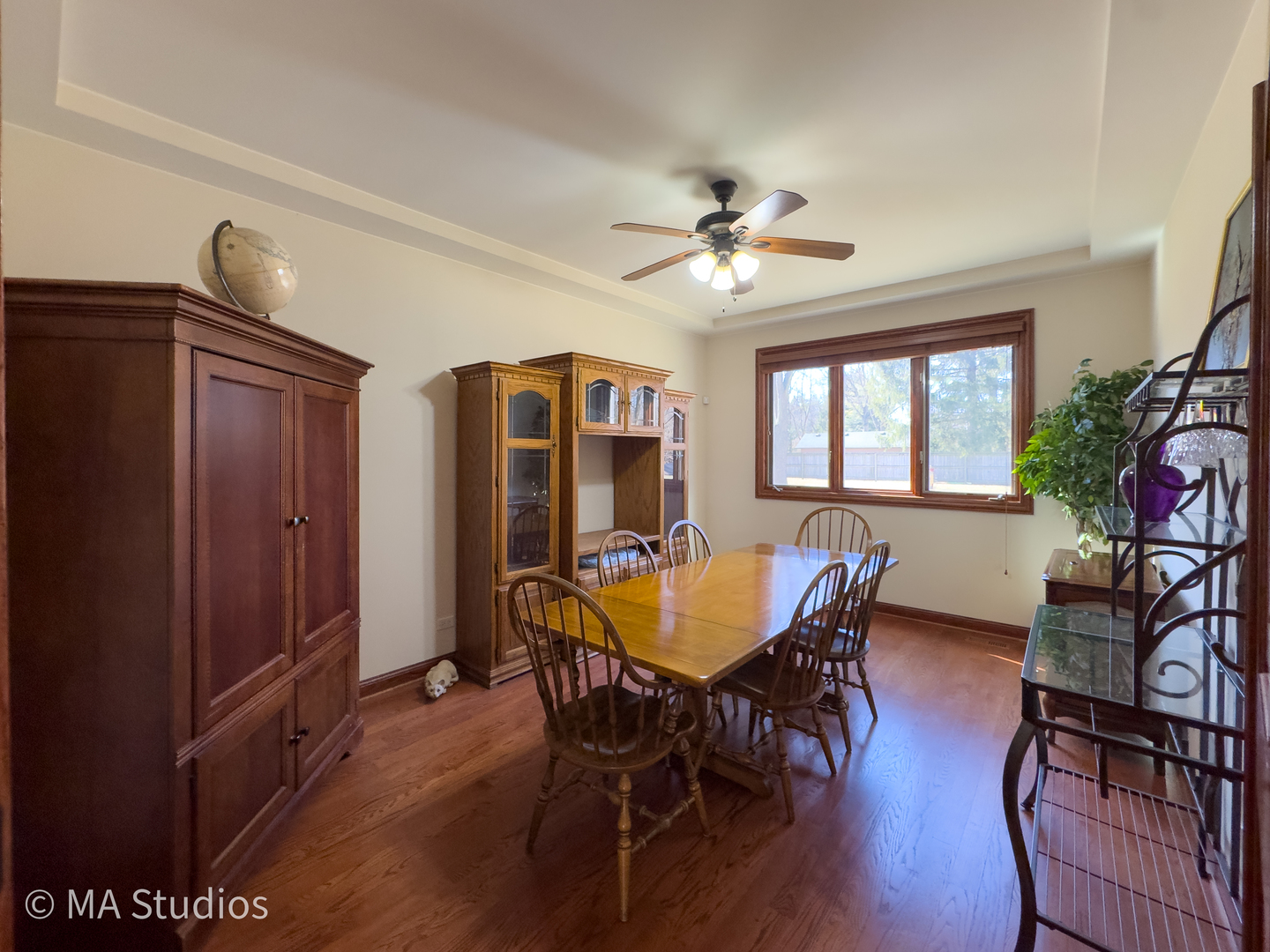 9030 Elm Avenue Burr Ridge, IL 60527 - Photo 13 of 72 a view of a dining room with furniture window and wooden floor