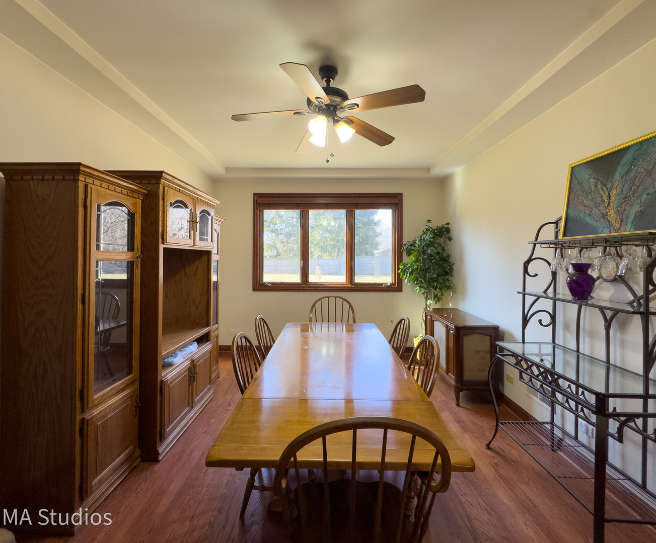 9030 Elm Avenue Burr Ridge, IL 60527 - Photo 14 of 72 a view of a dining room with furniture window and wooden floor