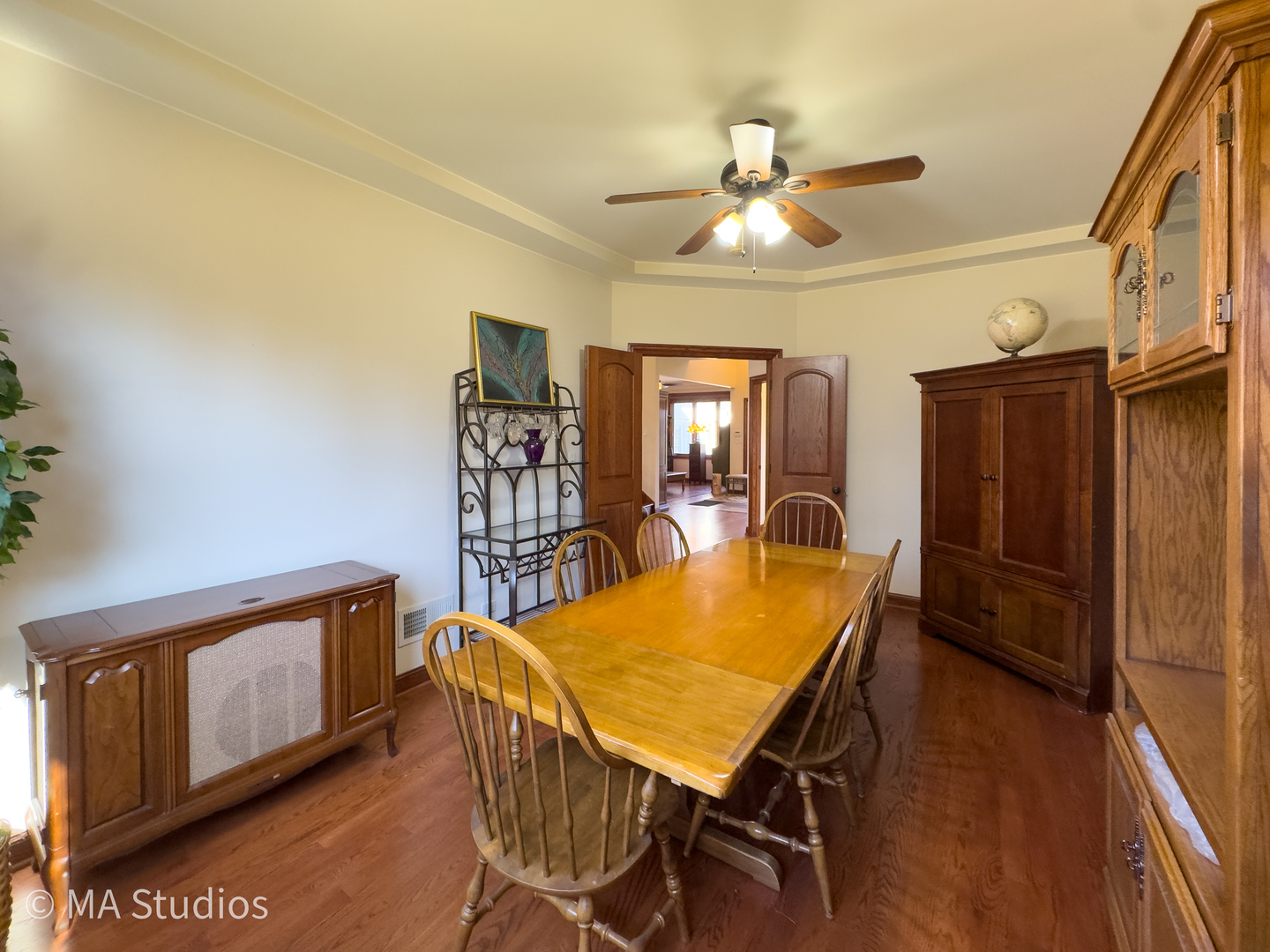 9030 Elm Avenue Burr Ridge, IL 60527 - Photo 15 of 72 a view of a dining room with furniture and wooden floor