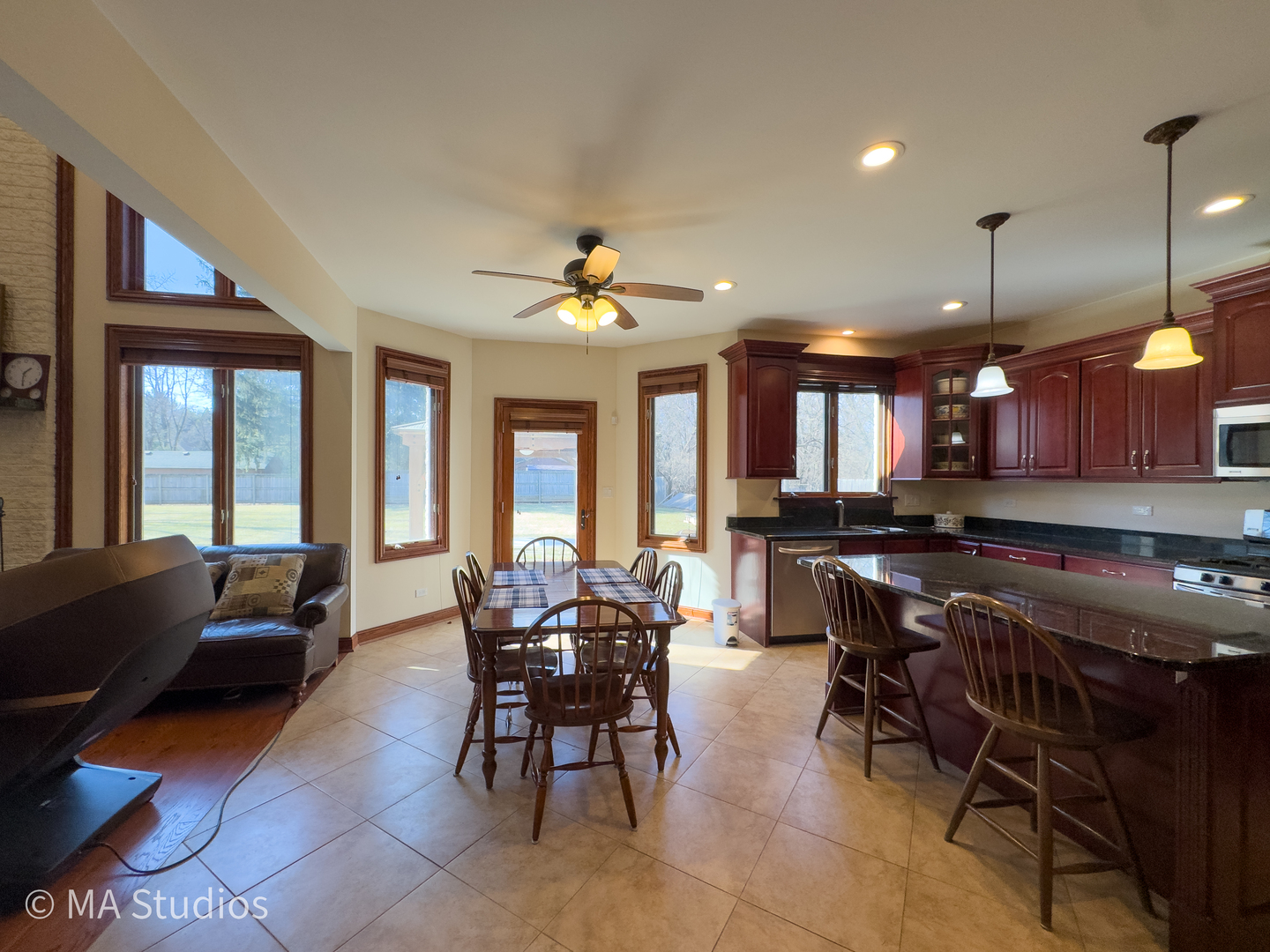 9030 Elm Avenue Burr Ridge, IL 60527 - Photo 16 of 72 a view of a dining room with furniture window and wooden floor