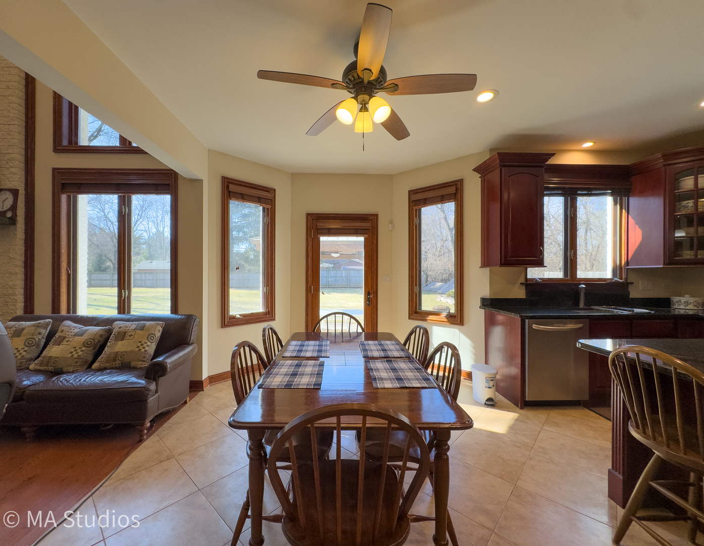 9030 Elm Avenue Burr Ridge, IL 60527 - Photo 17 of 72 a view of a dining room with furniture and a chandelier