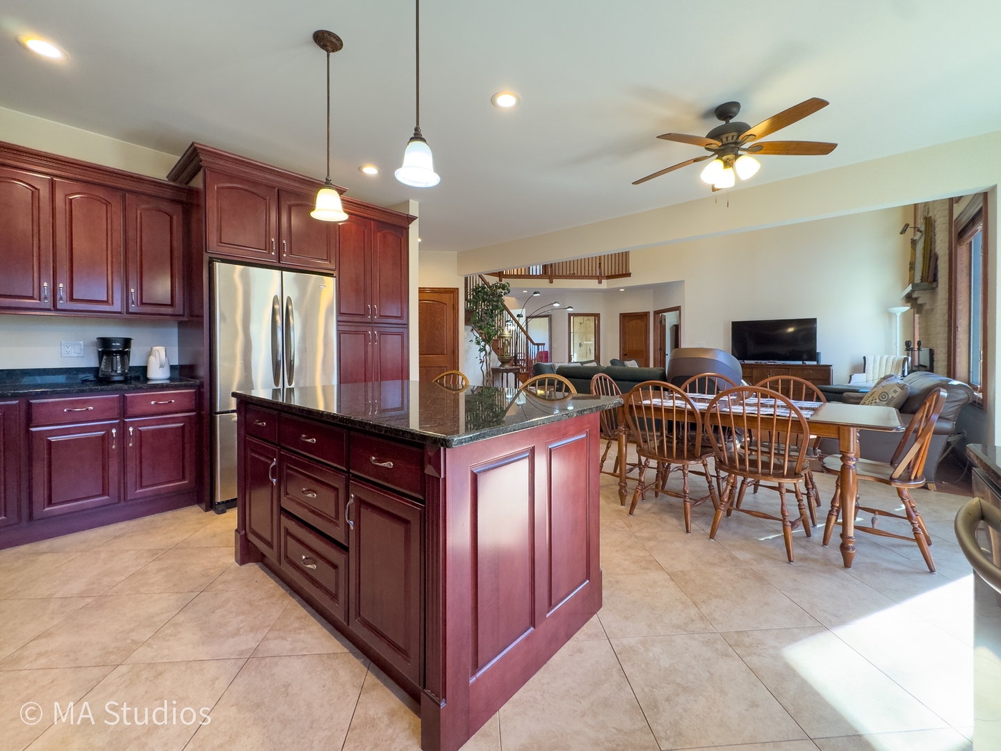 9030 Elm Avenue Burr Ridge, IL 60527 - Photo 24 of 72 a kitchen with stainless steel appliances granite countertop a stove top oven a refrigerator a sink dishwasher a dining table and chairs with wooden floor