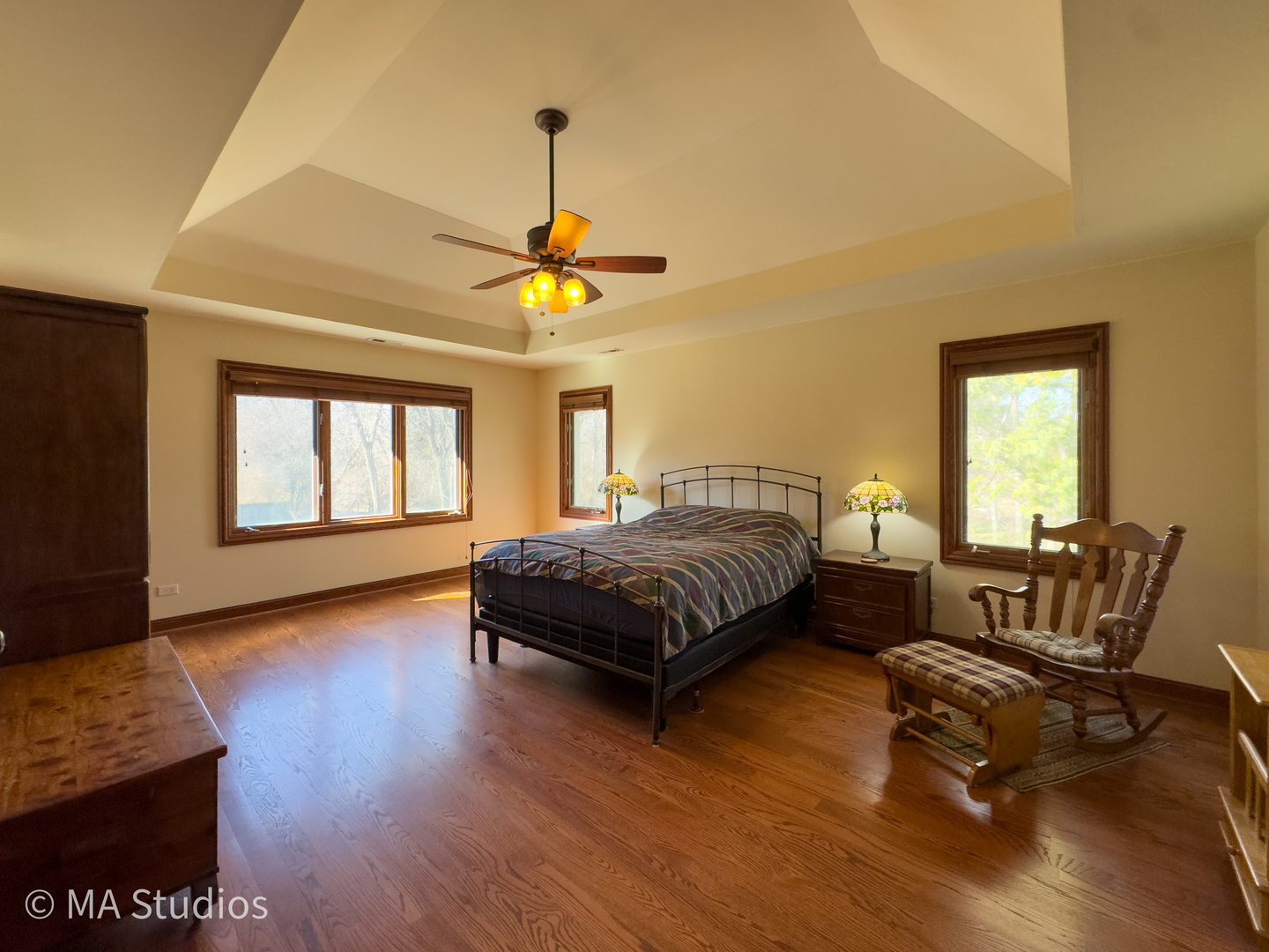 9030 Elm Avenue Burr Ridge, IL 60527 - Photo 34 of 72 a bedroom with a bed and wooden floor