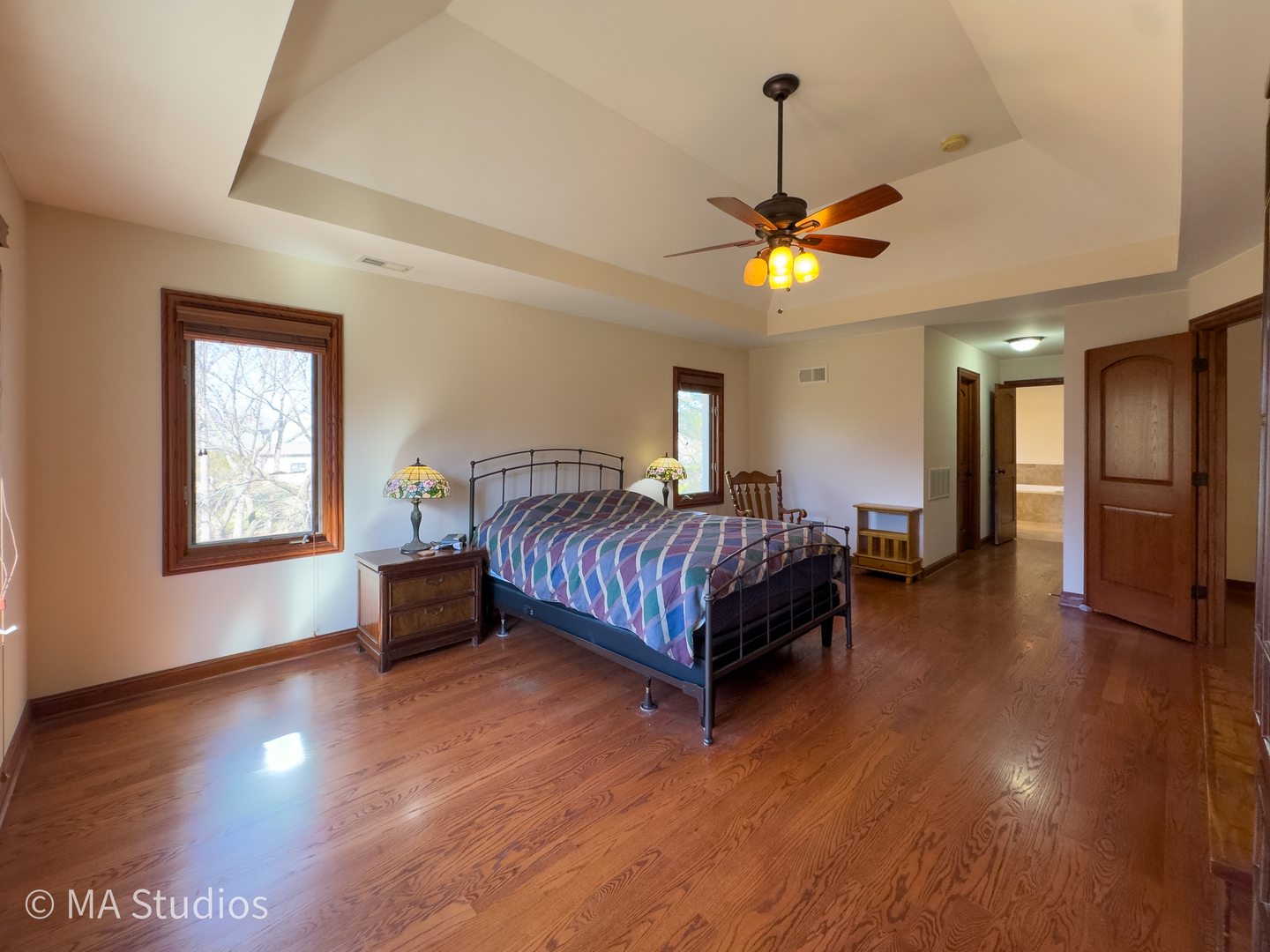 9030 Elm Avenue Burr Ridge, IL 60527 - Photo 35 of 72 a bedroom with a bed chandelier and a window