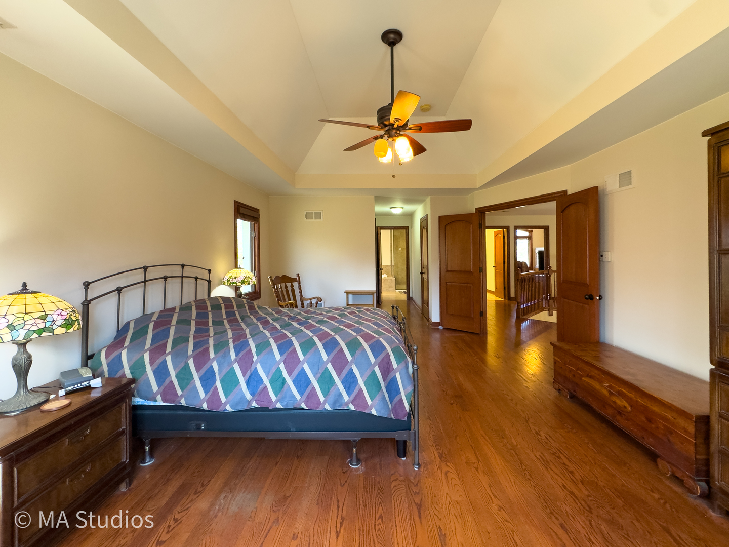 9030 Elm Avenue Burr Ridge, IL 60527 - Photo 36 of 72 a bedroom with a bed and wooden floor