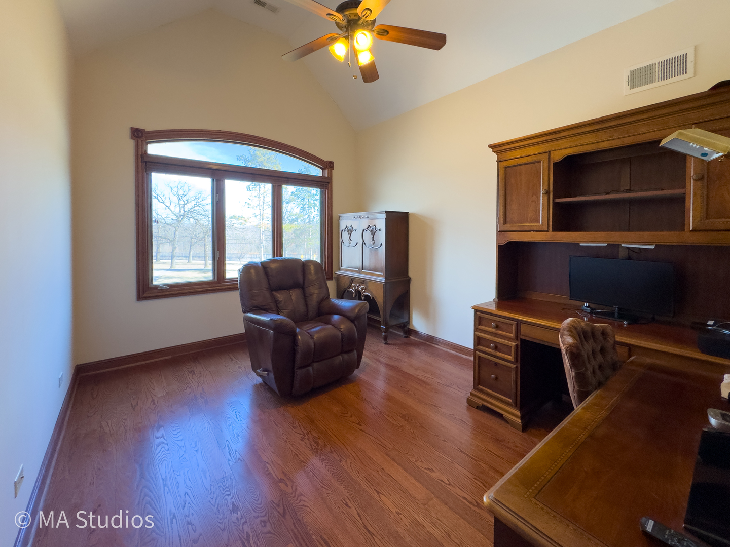 9030 Elm Avenue Burr Ridge, IL 60527 - Photo 44 of 72 a living room with furniture and a flat screen tv