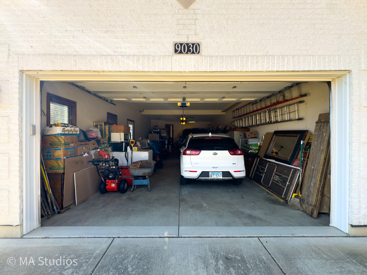 9030 Elm Avenue Burr Ridge, IL 60527 - Photo 57 of 72 a view of parking garage with cars and other equipment