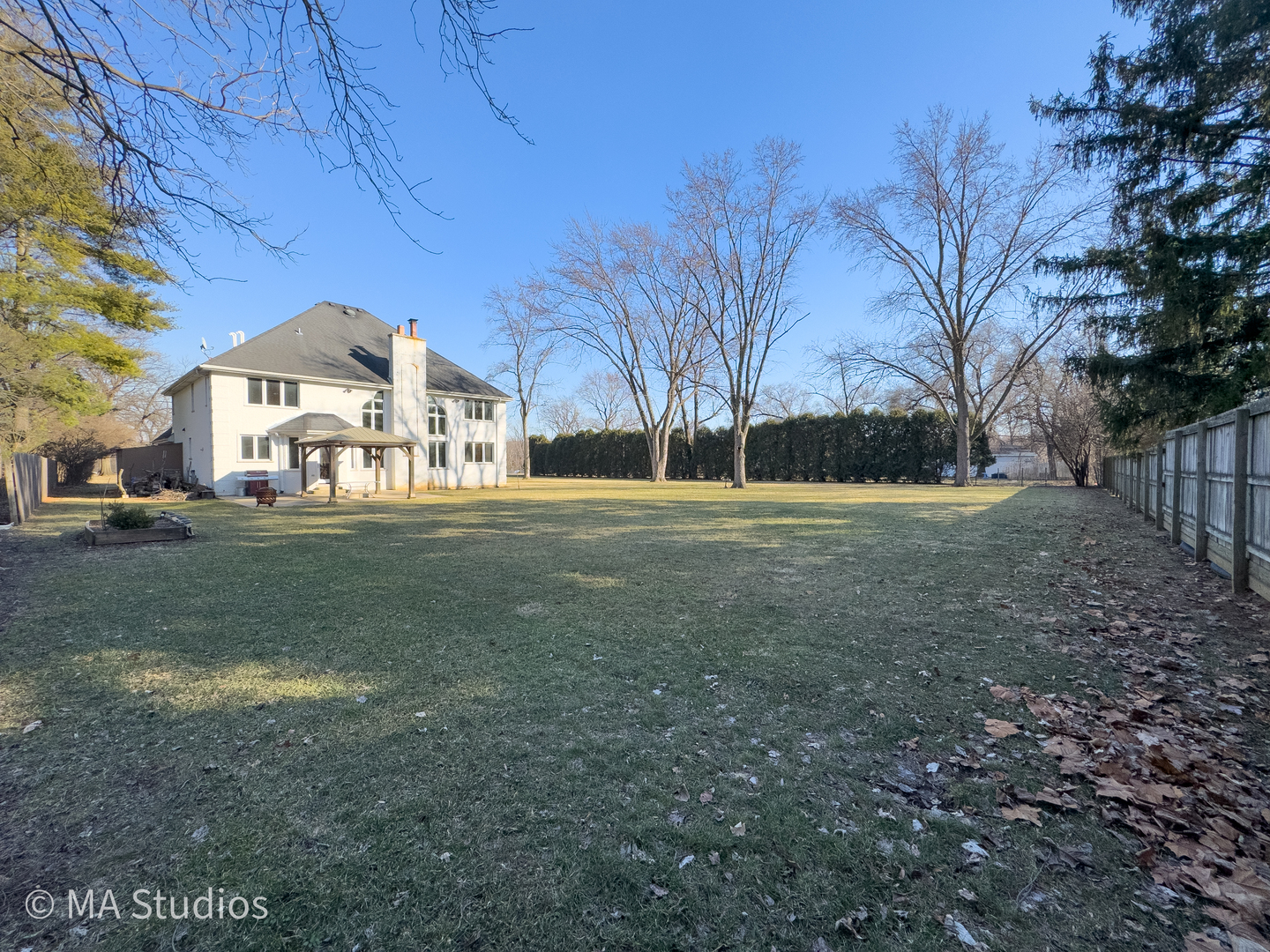 9030 Elm Avenue Burr Ridge, IL 60527 - Photo 59 of 72 a front view of a house with a yard