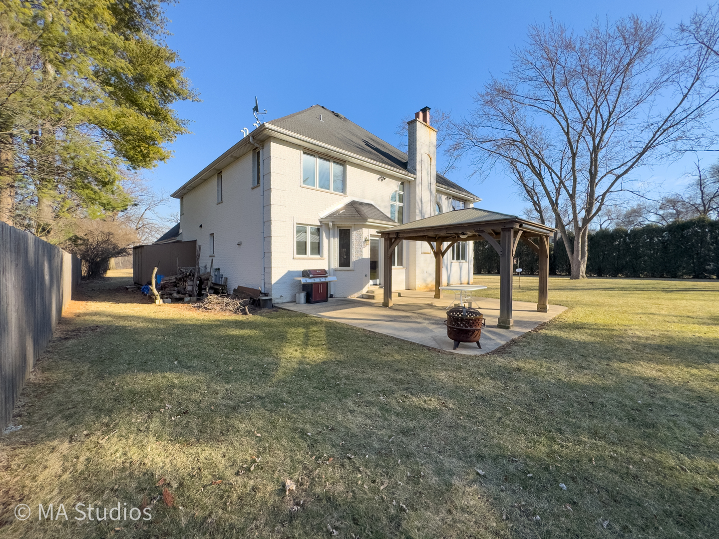 9030 Elm Avenue Burr Ridge, IL 60527 - Photo 61 of 72 a view of a white house with a big yard and large trees