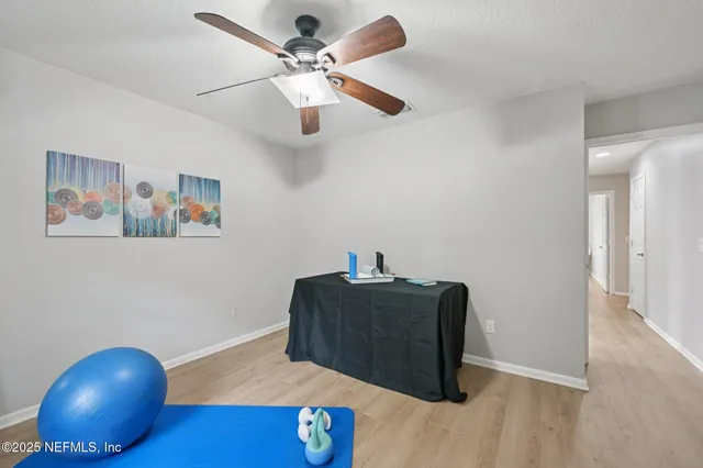 a view of workspace with wooden floor