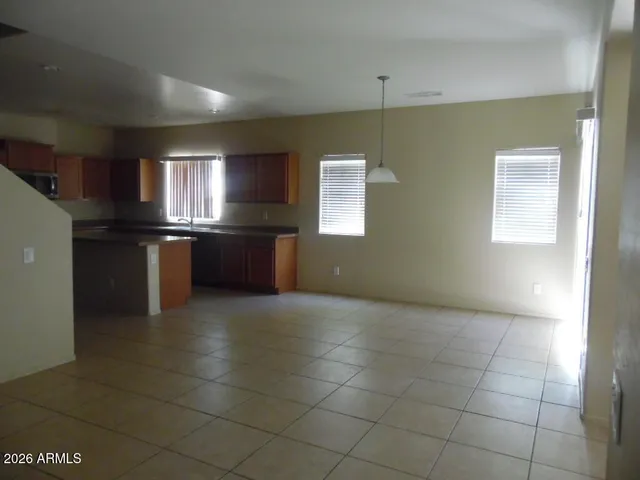 a kitchen with stainless steel appliances granite countertop a sink and a stove