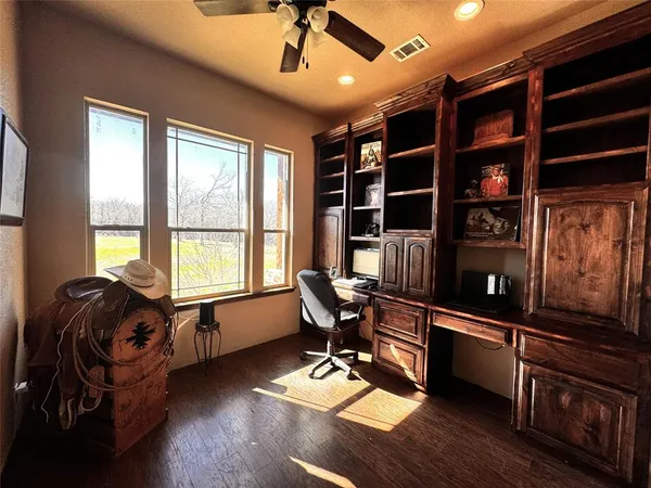 a work room with furniture and windows