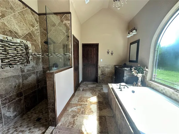 a bathroom with a sink and mirror