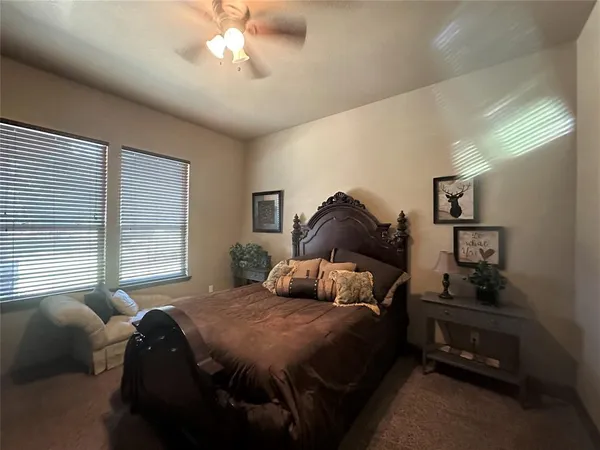 a bedroom with a bed and window