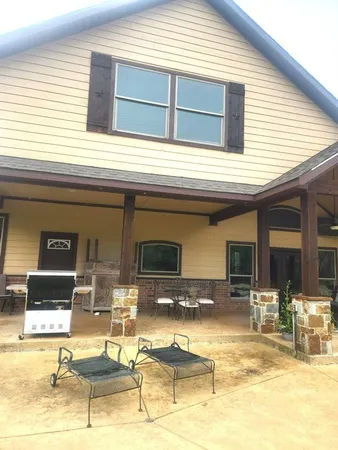 a view of a patio with chairs