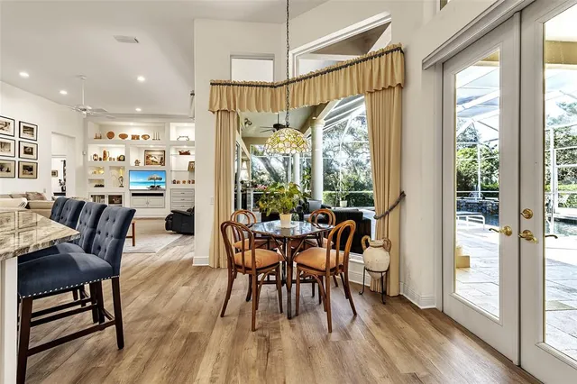a view of a dining room with furniture window and wooden floor