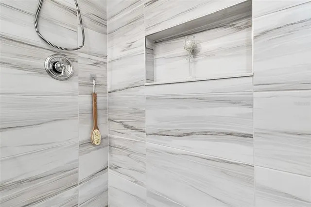 a bedroom with two beds and a window