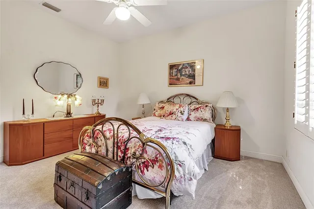 a living room with furniture a piano and a window