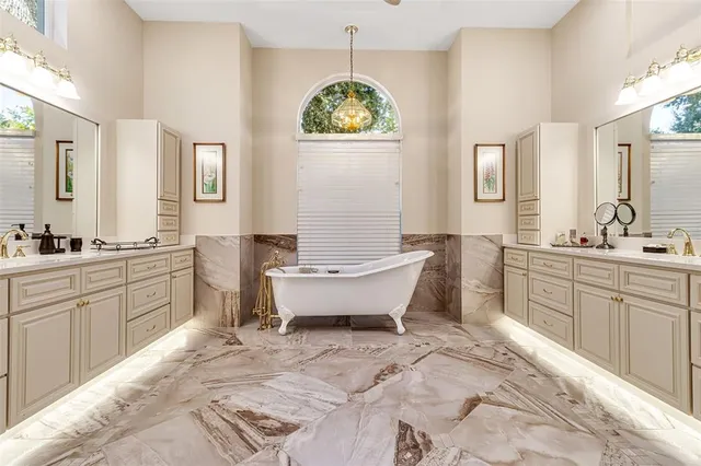 a bathroom with a sink double vanity and a mirror