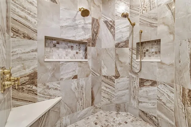 a view of a dining room with furniture and chandelier