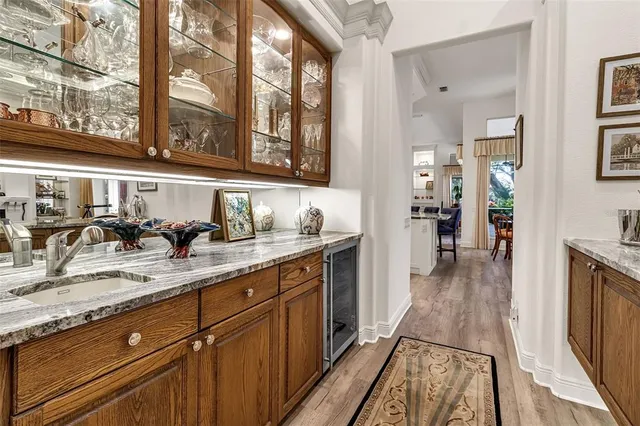 a hallway with sink and large windows