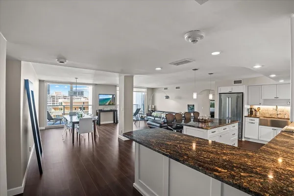 a kitchen with lots of counter top space and living room