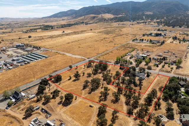 a view of sink with glass windows and painted walls