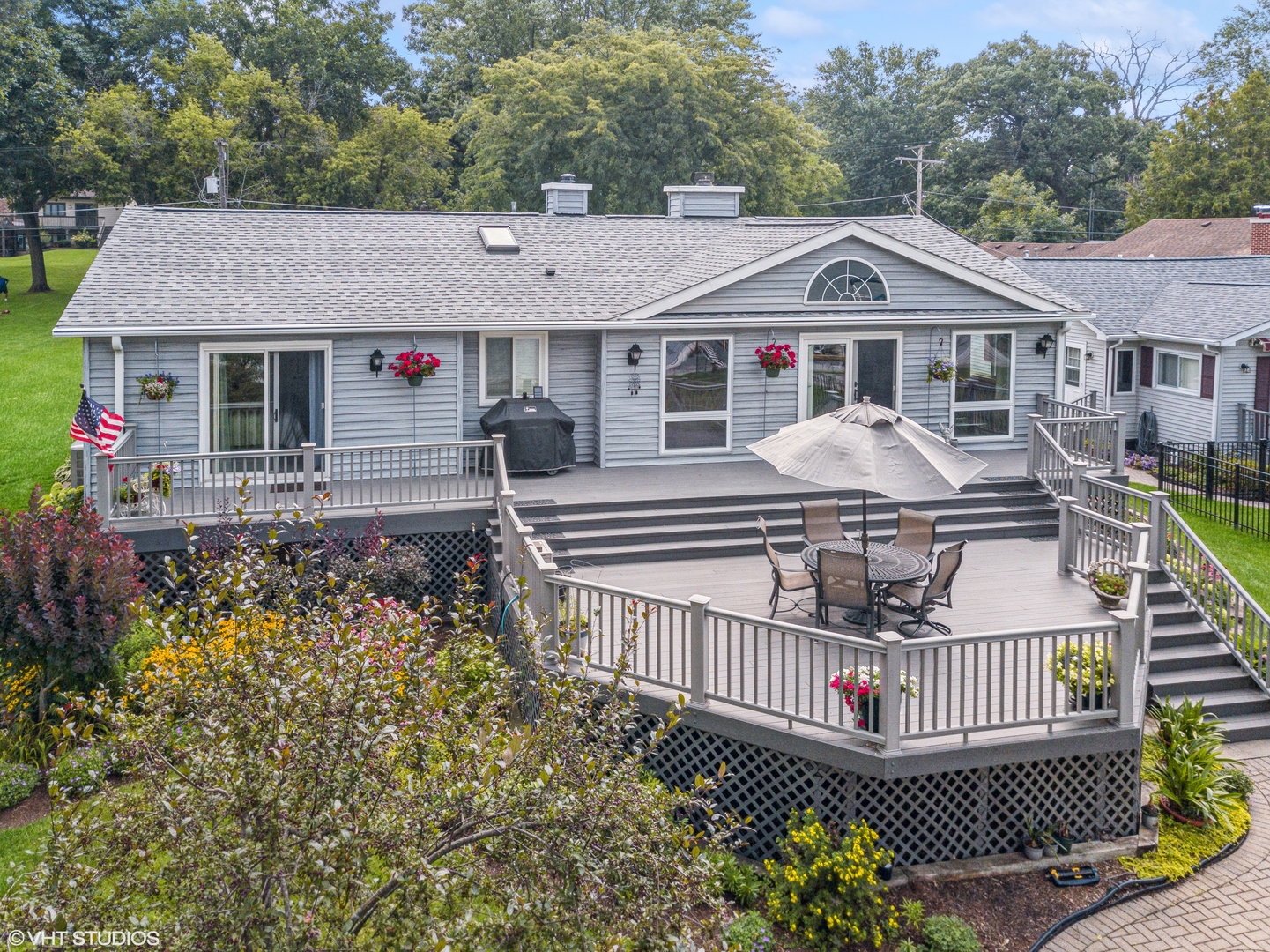 307 North Emerald Drive McHenry, IL 60051 - Photo 2 of 34 a front view of a house with garden and deck