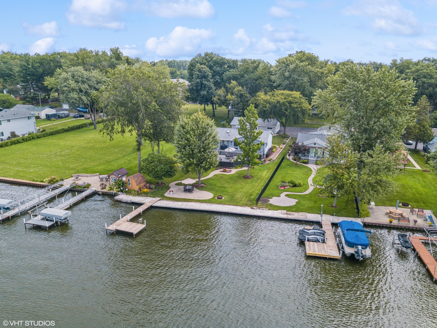 307 North Emerald Drive McHenry, IL 60051 - Photo 24 of 34 an aerial view of a swimming pool with a patio and a yard