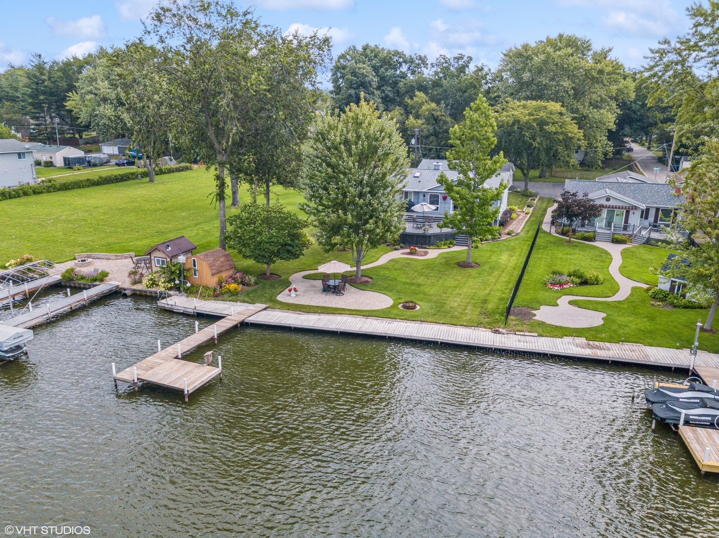 307 North Emerald Drive McHenry, IL 60051 - Photo 31 of 34 an aerial view of a pool with a yard and a garden