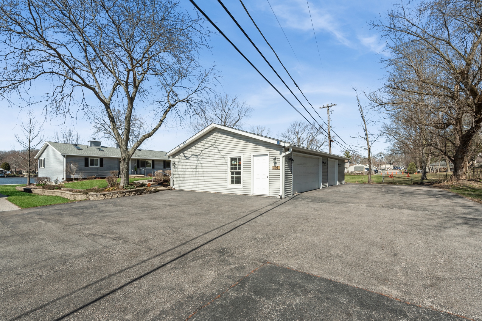 307 North Emerald Drive McHenry, IL 60051 - Photo 34 of 34 a view of a house with a yard and garage