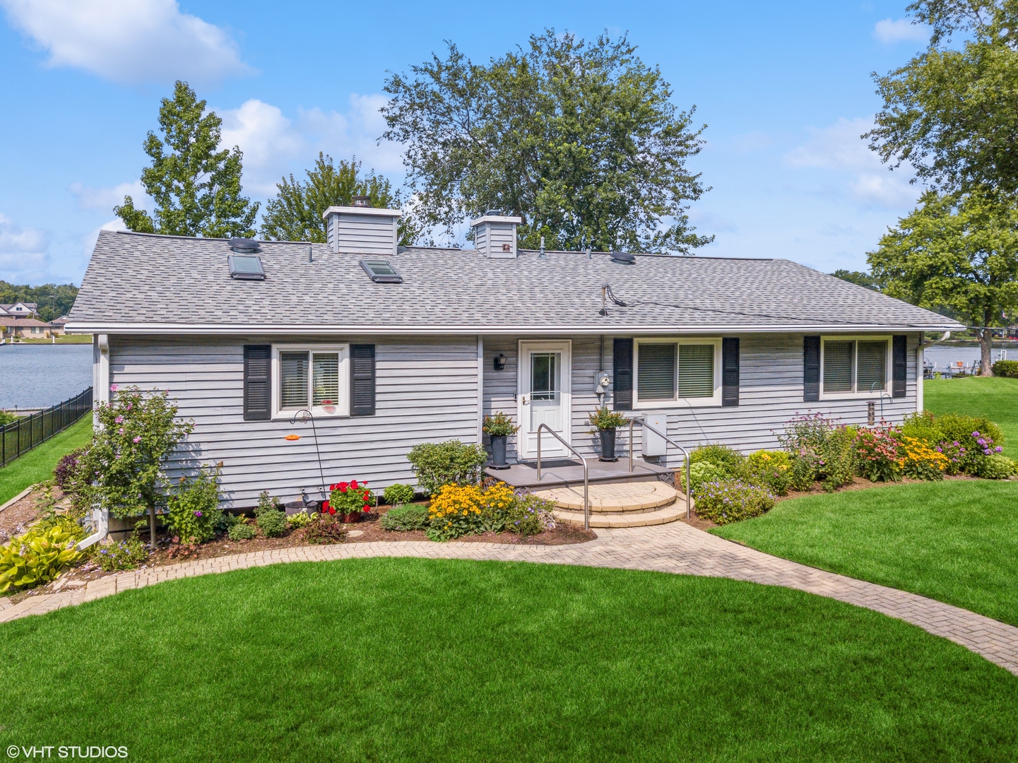 307 North Emerald Drive McHenry, IL 60051 - Photo 7 of 34 a front view of a house with a yard and porch