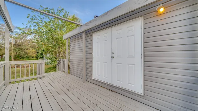 a view of balcony with wooden floor