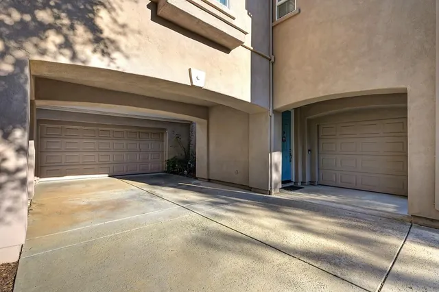 a view of a house with a door and wooden walls