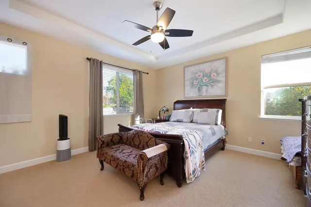 a bedroom with bed and furniture