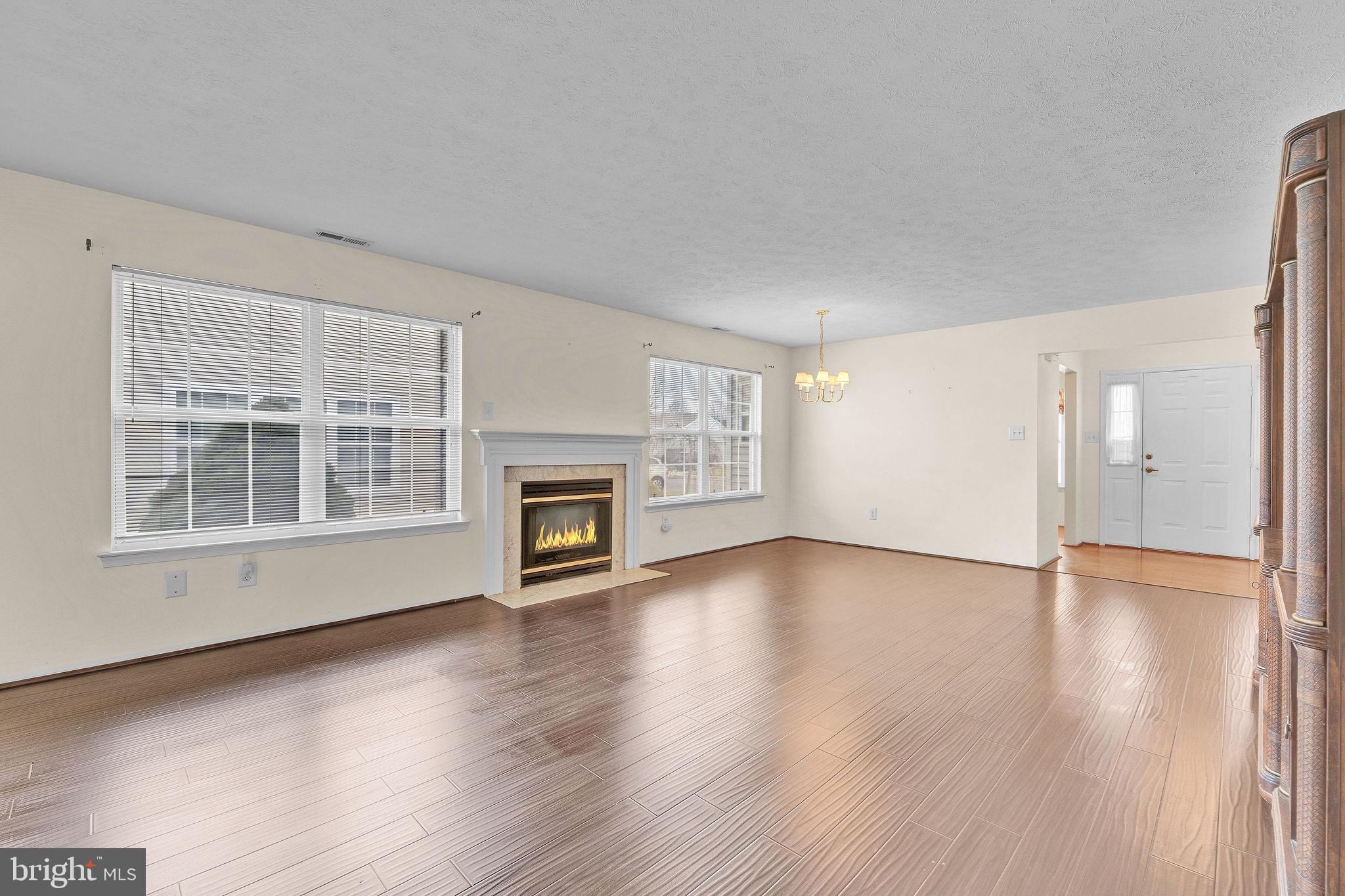 310 Moonseed Place Mount Laurel, NJ 08054 - Photo 12 of 27 a view of an empty room with wooden floor and a window