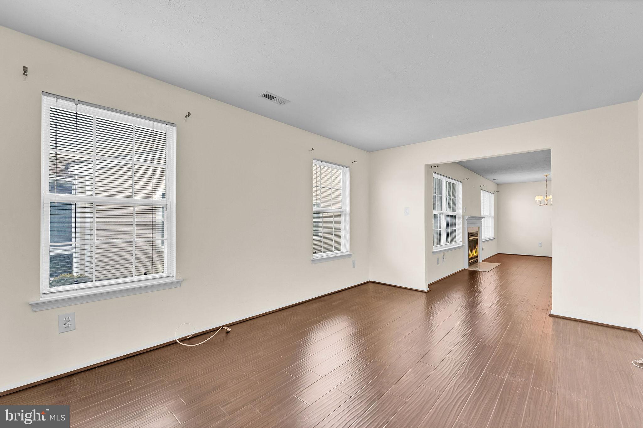 310 Moonseed Place Mount Laurel, NJ 08054 - Photo 13 of 27 a view of empty room with wooden floor and fan