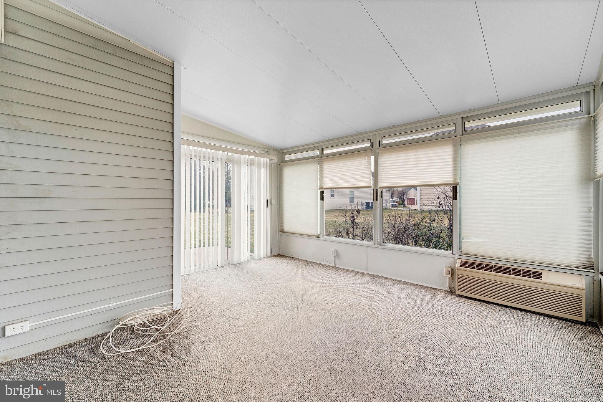 310 Moonseed Place Mount Laurel, NJ 08054 - Photo 24 of 27 a view of an empty room with a sliding door