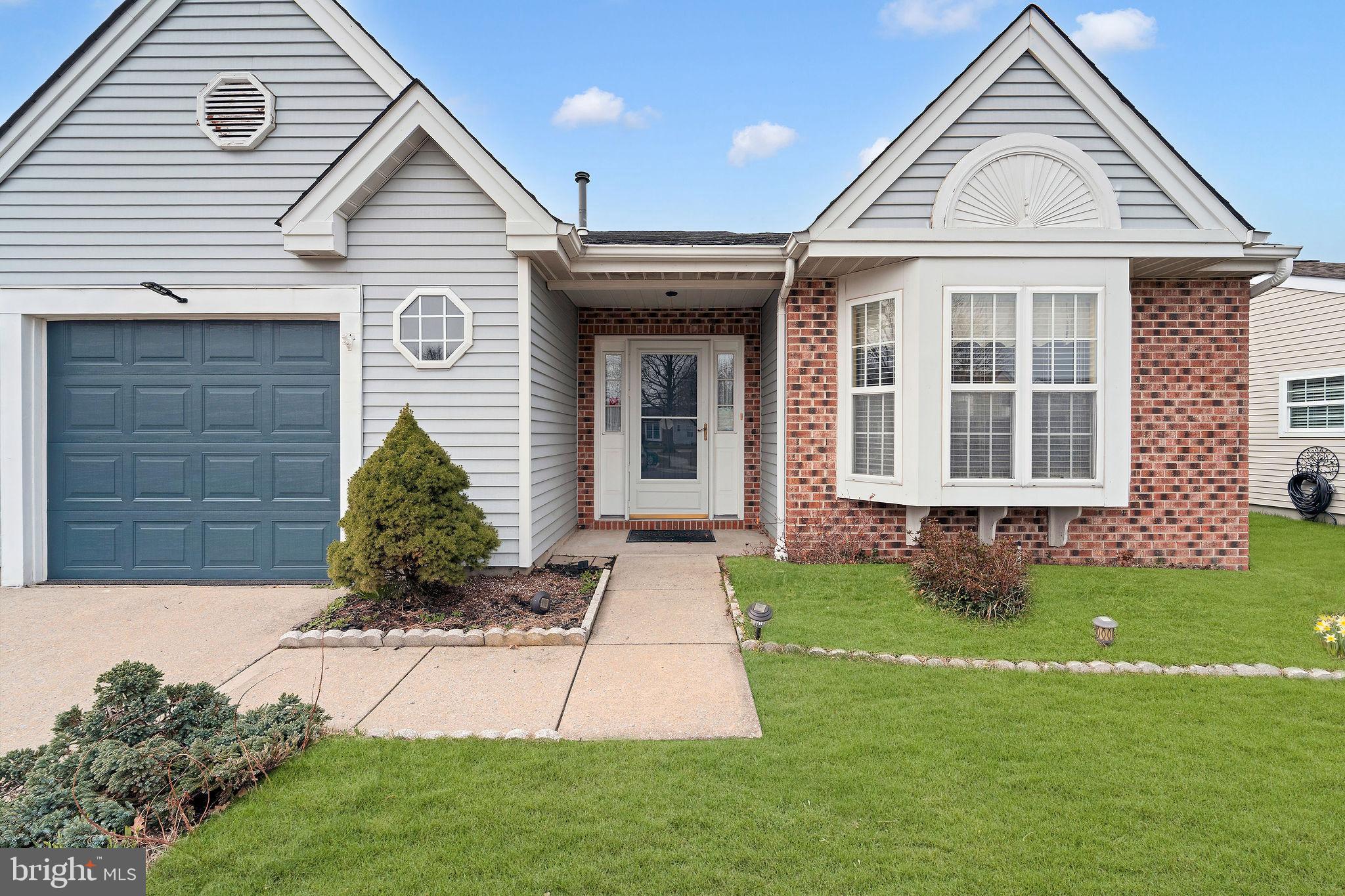 310 Moonseed Place Mount Laurel, NJ 08054 - Photo 3 of 27 a front view of a house with a yard