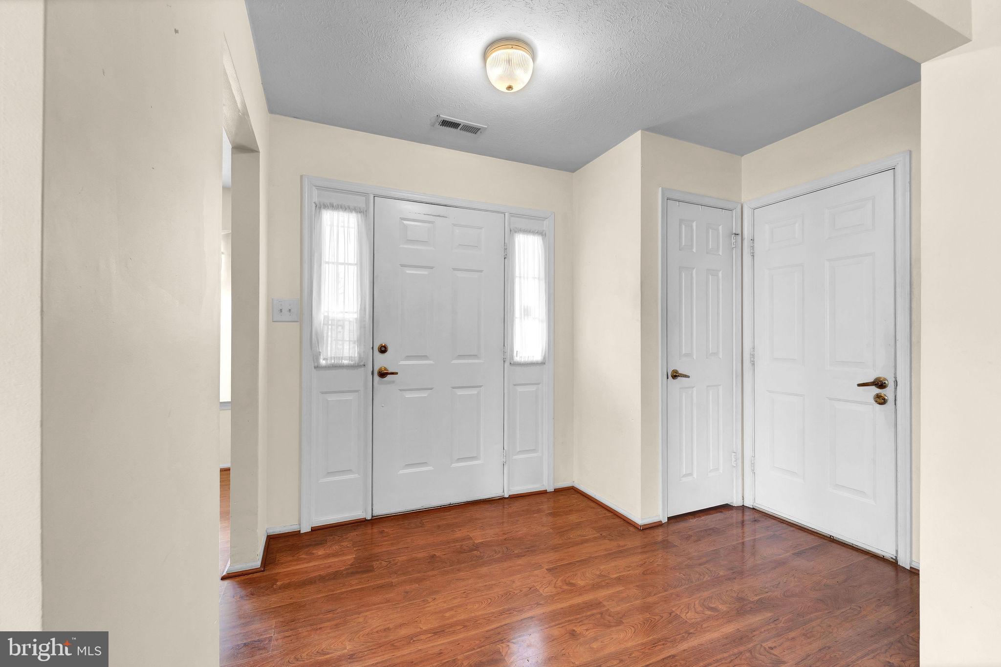 310 Moonseed Place Mount Laurel, NJ 08054 - Photo 4 of 27 a view of an empty room and wooden floor