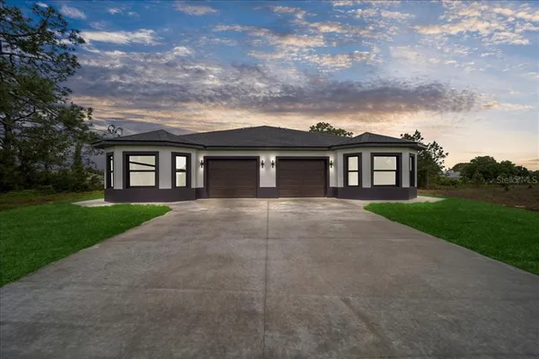 front view of a house with a yard