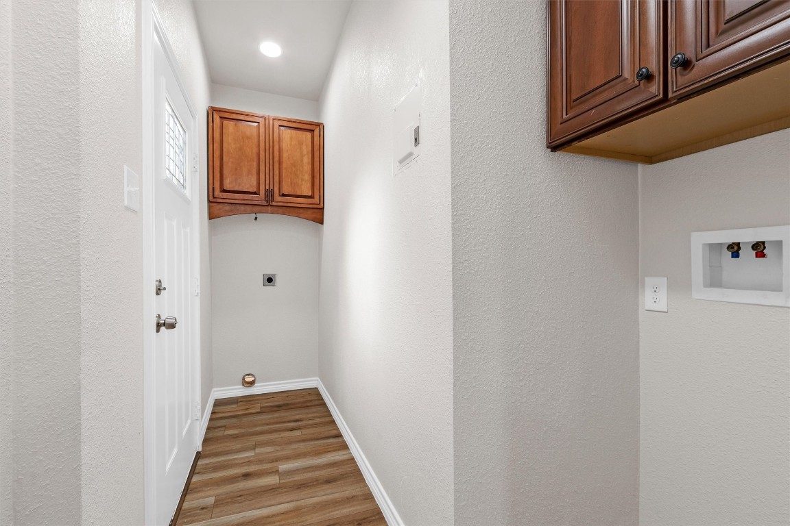 338 South Walker Road Conroe, TX 77306 - Photo 14 of 25 a view of a hallway with wooden floor and entryway