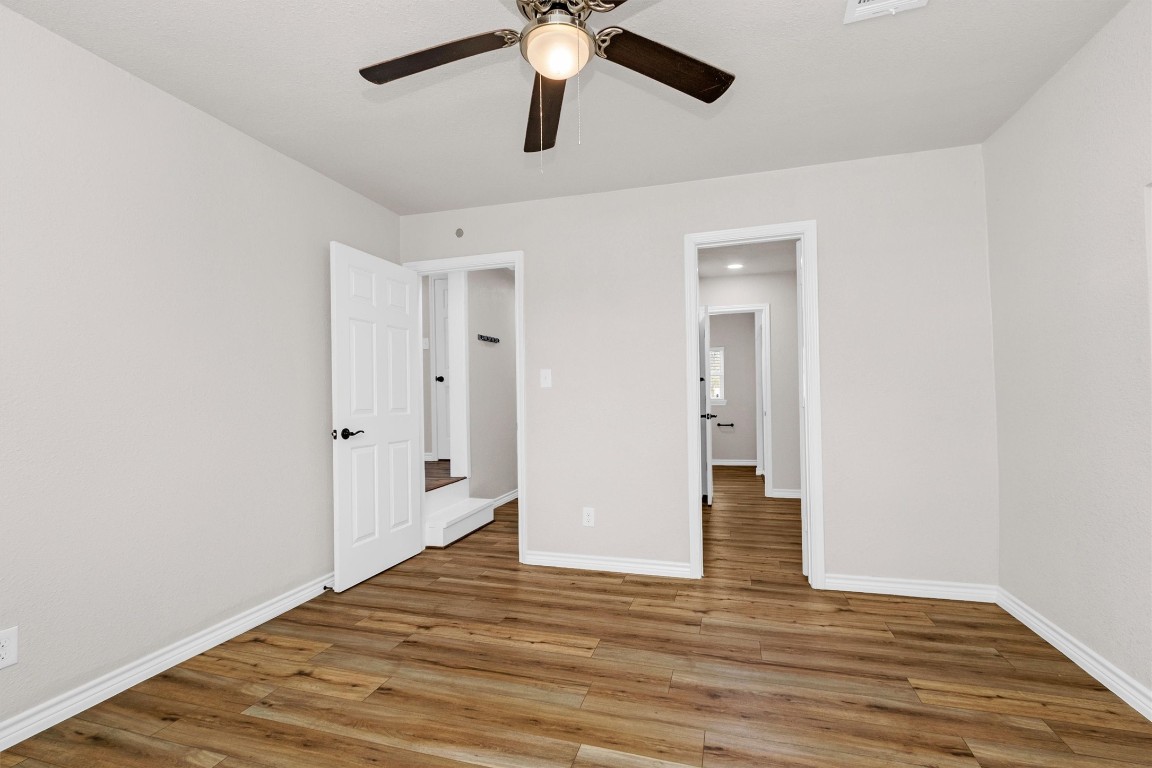 338 South Walker Road Conroe, TX 77306 - Photo 16 of 25 a view of an empty room and wooden floor