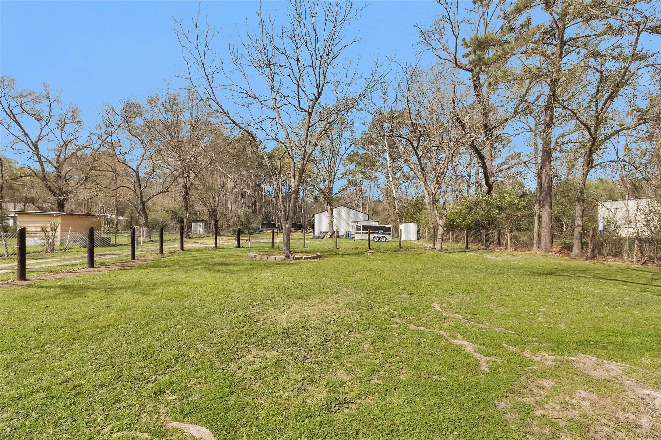 338 South Walker Road Conroe, TX 77306 - Photo 23 of 25 a view of road with trees