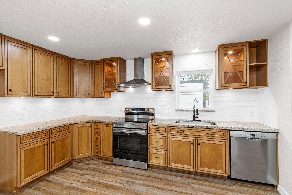 338 South Walker Road Conroe, TX 77306 - Photo 8 of 25 a kitchen with a sink and cabinets