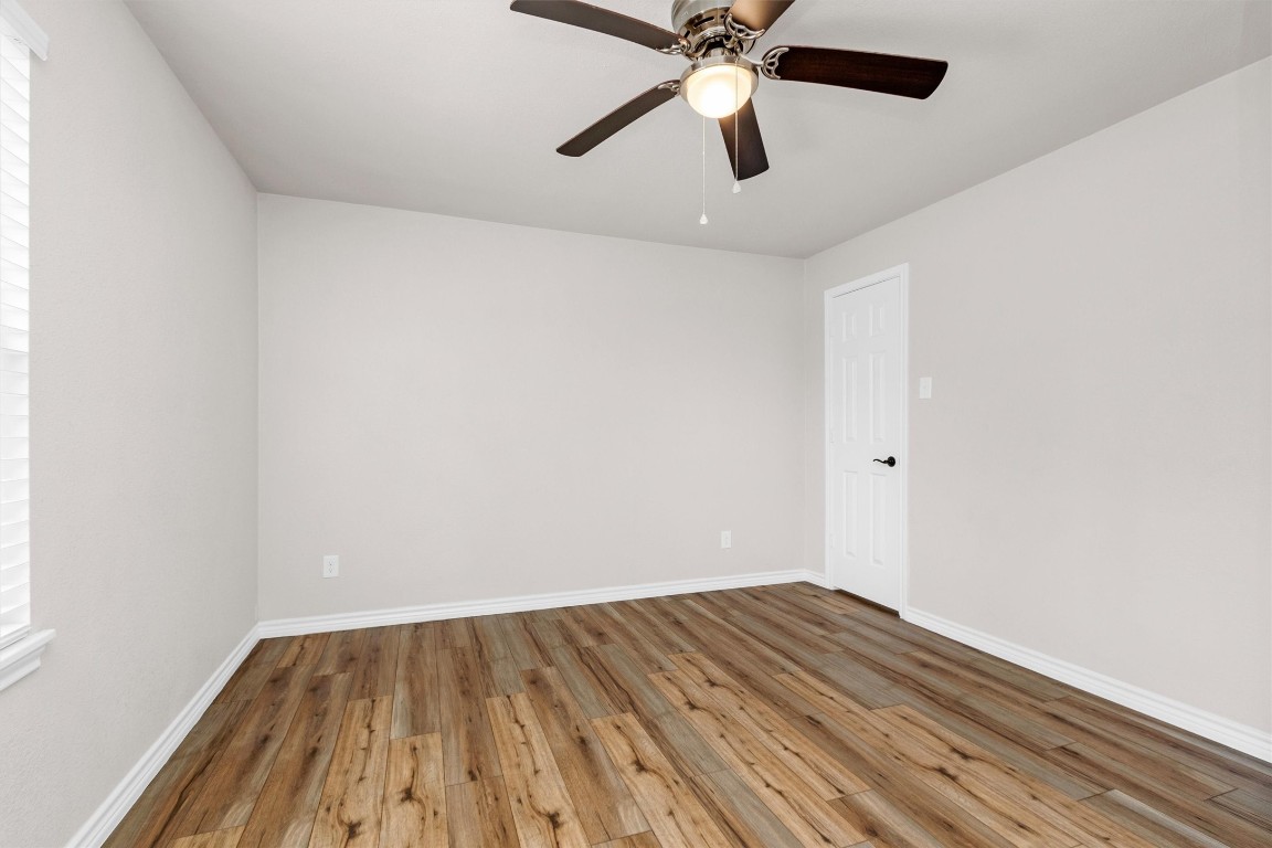 338 South Walker Road Conroe, TX 77306 - Photo 9 of 25 wooden floor in an empty room